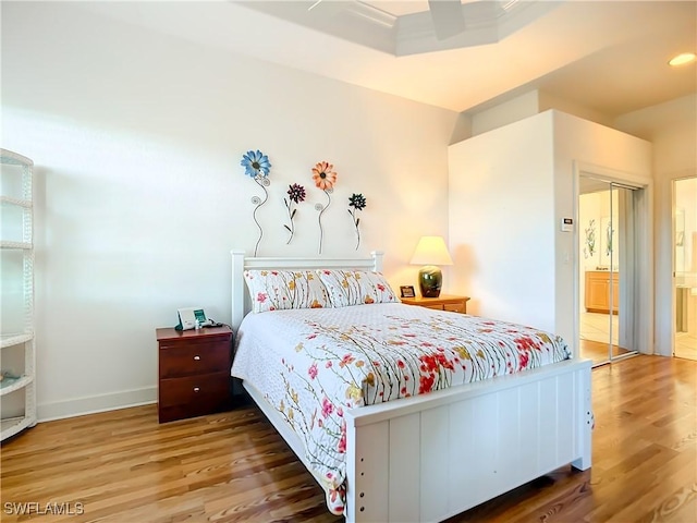 bedroom with hardwood / wood-style flooring and ceiling fan