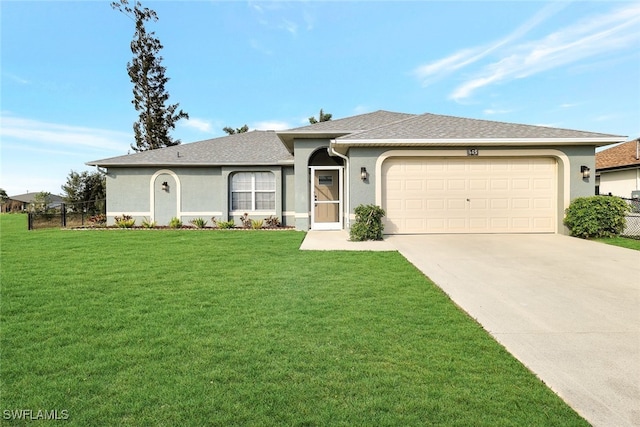 ranch-style house featuring a front yard and a garage