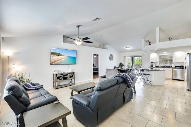 living room featuring ceiling fan, sink, light tile patterned floors, and high vaulted ceiling