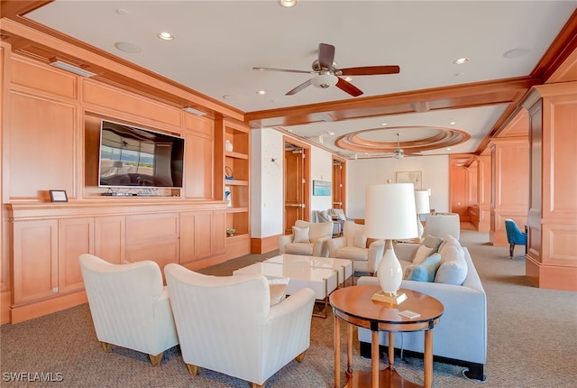 carpeted living room featuring ceiling fan, built in features, and crown molding