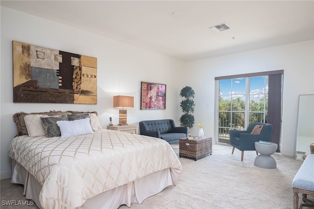 bedroom with carpet floors and access to outside