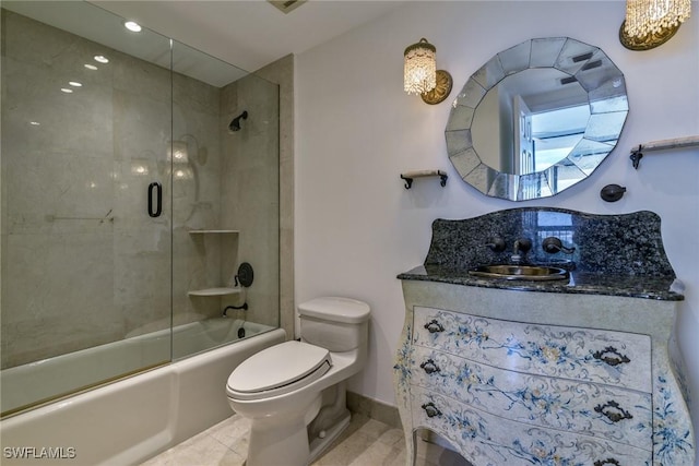 full bathroom featuring toilet, combined bath / shower with glass door, tile patterned flooring, and vanity