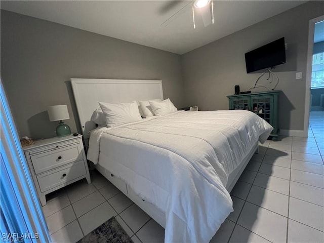 tiled bedroom with ceiling fan