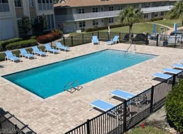 view of swimming pool with a patio area