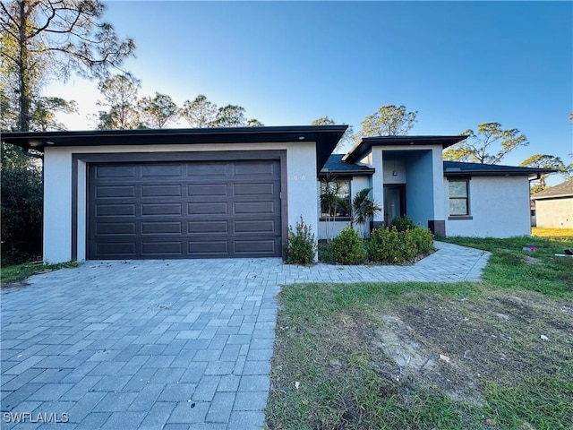 view of front of home with a garage