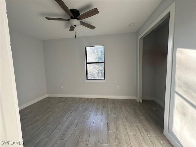 unfurnished room featuring light hardwood / wood-style floors and ceiling fan