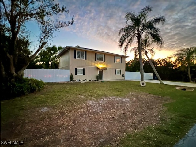 view of front of house with a yard