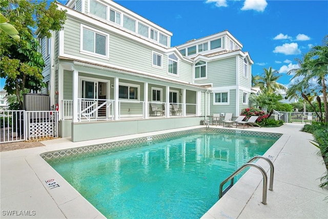 view of swimming pool with a patio