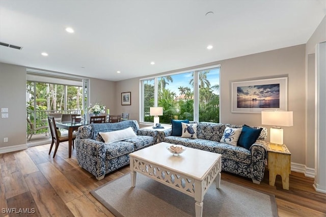 living room with light hardwood / wood-style floors