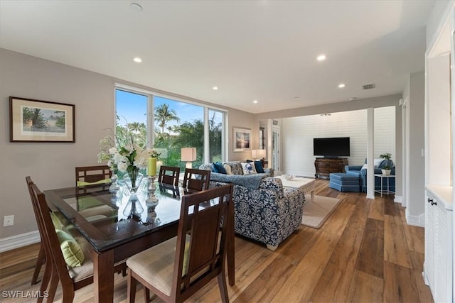 dining area with hardwood / wood-style flooring