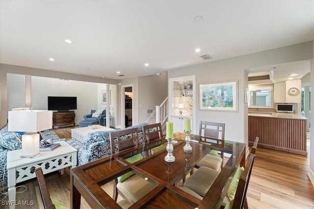 dining space featuring light hardwood / wood-style floors