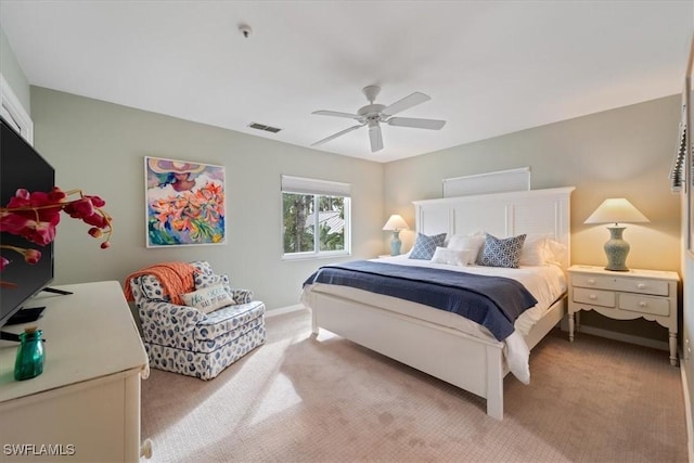 bedroom with ceiling fan and light colored carpet