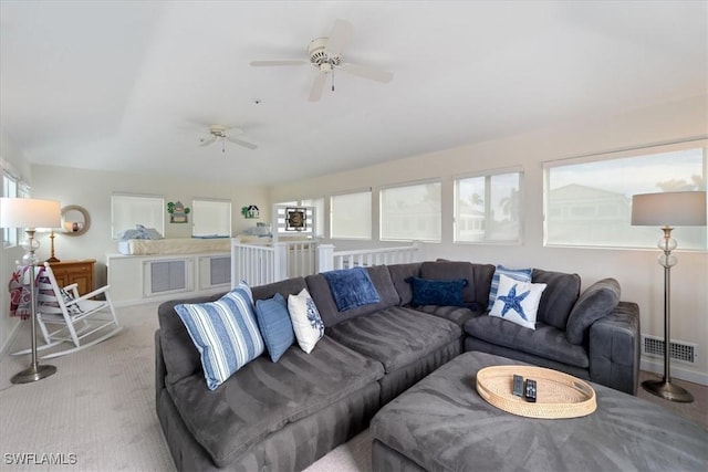 carpeted living room featuring ceiling fan