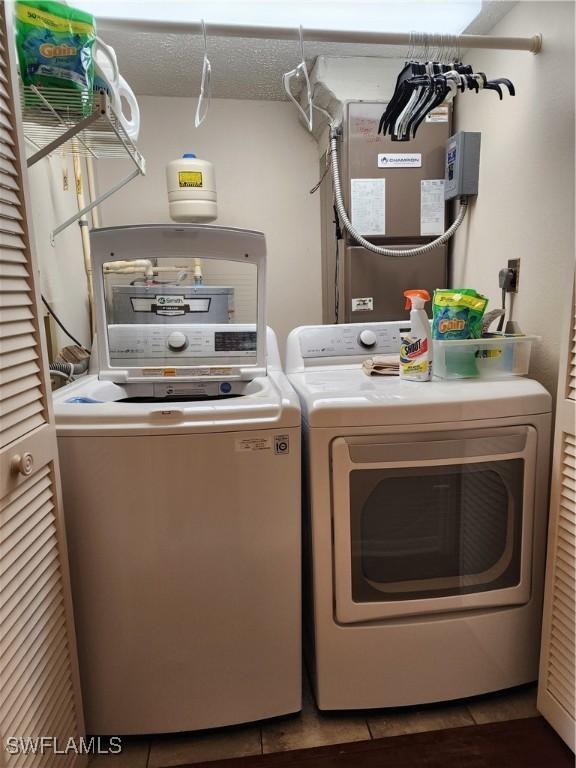 washroom with washing machine and dryer