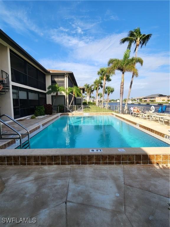 view of swimming pool with a patio