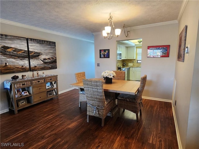 dining area with a chandelier, dark hardwood / wood-style flooring, a textured ceiling, and crown molding