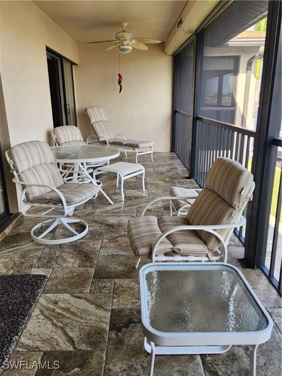 balcony featuring ceiling fan