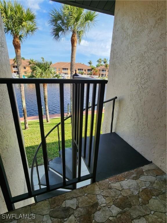 balcony featuring a water view