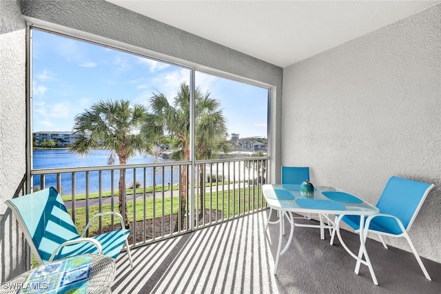 sunroom with a water view