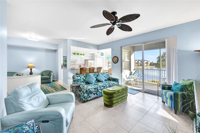 tiled living room with ceiling fan