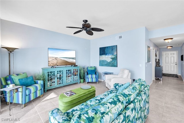 living room featuring tile patterned floors and ceiling fan