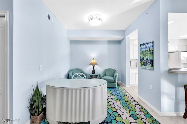 living area featuring light tile patterned floors