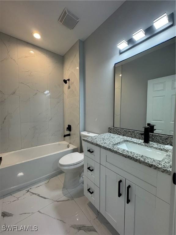 full bathroom featuring toilet, vanity, and tiled shower / bath combo