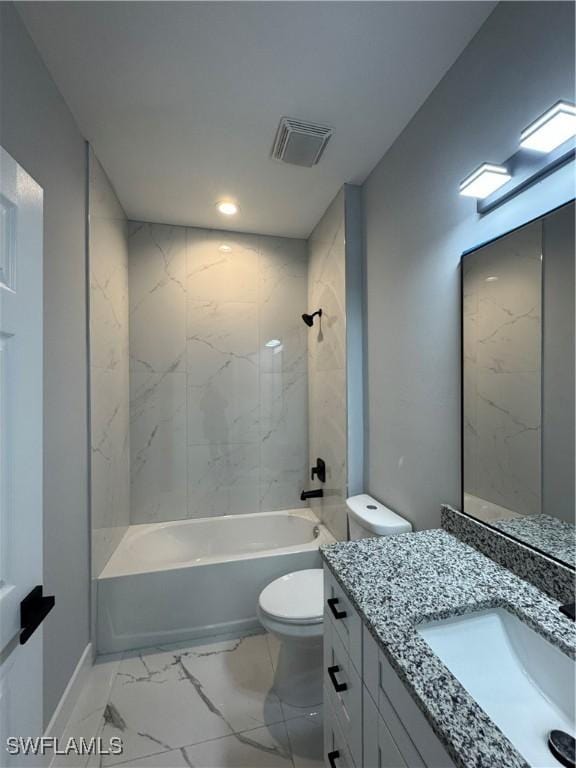 full bathroom featuring toilet, vanity, and tiled shower / bath