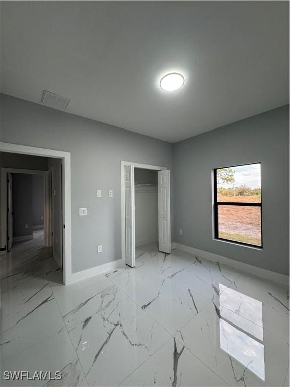 unfurnished bedroom featuring a closet