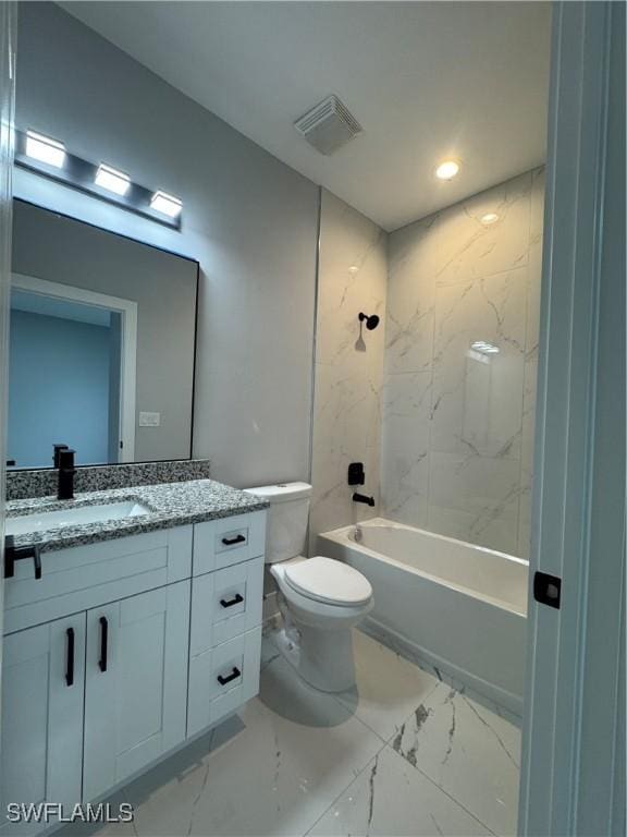 full bathroom with vanity, tiled shower / bath combo, and toilet