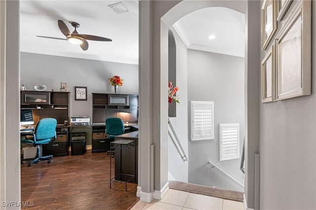 tiled office with ceiling fan and ornamental molding