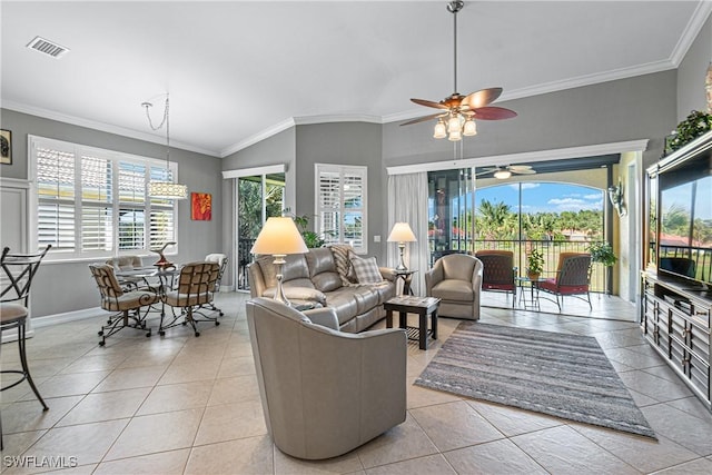 living room featuring a healthy amount of sunlight, ornamental molding, and light tile patterned floors