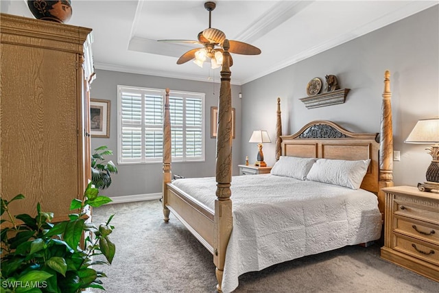 bedroom featuring carpet flooring, ceiling fan, a raised ceiling, and ornamental molding