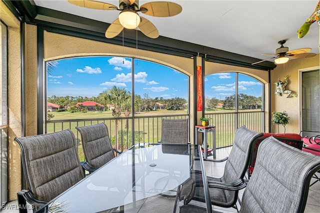 sunroom / solarium with ceiling fan