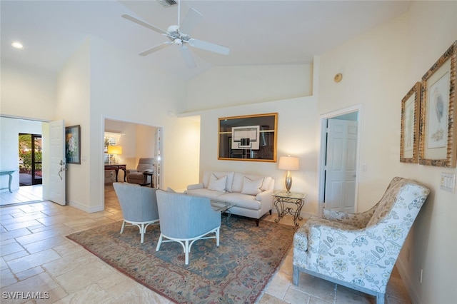 living room with ceiling fan and high vaulted ceiling