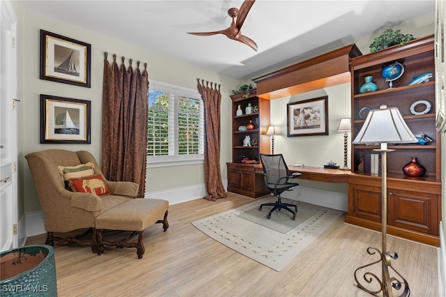 office space with ceiling fan and light hardwood / wood-style floors