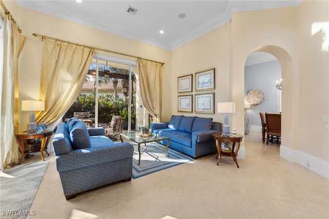 living room with light tile patterned floors and crown molding