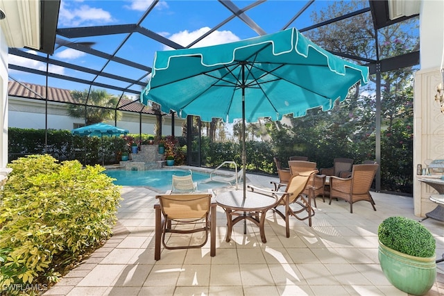 view of swimming pool featuring a patio, pool water feature, and a lanai