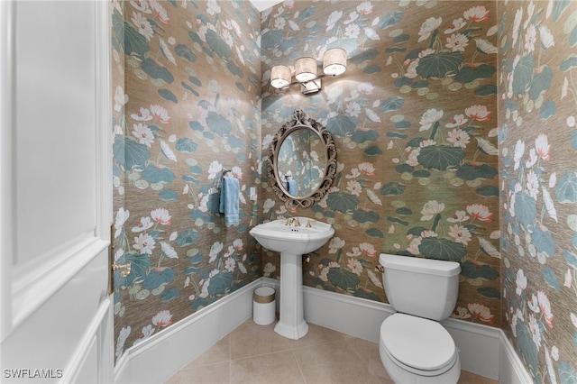 bathroom with tile patterned floors and toilet