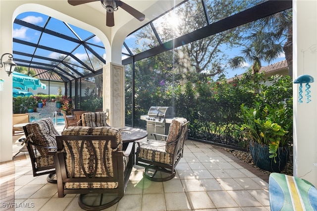 view of patio with a lanai and ceiling fan