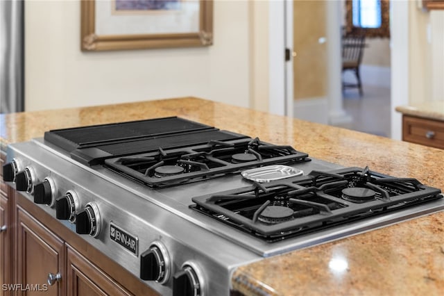 room details with stove and light stone counters