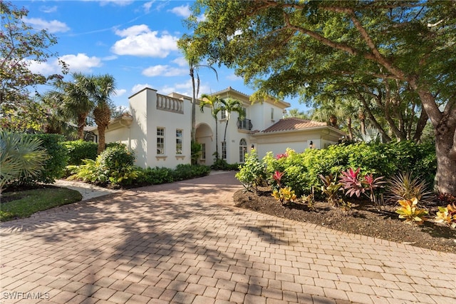 mediterranean / spanish house featuring a garage