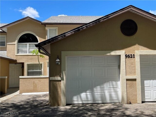 view of property exterior featuring a garage