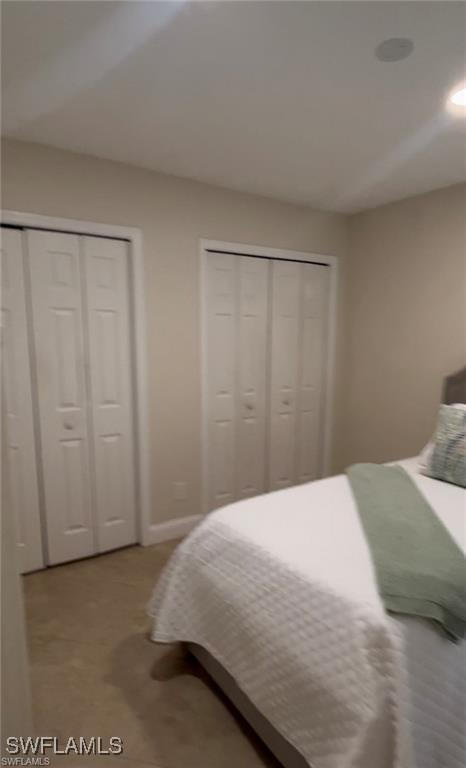 bedroom featuring two closets