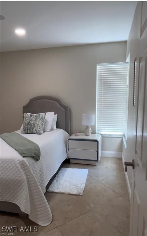 bedroom featuring light tile patterned floors