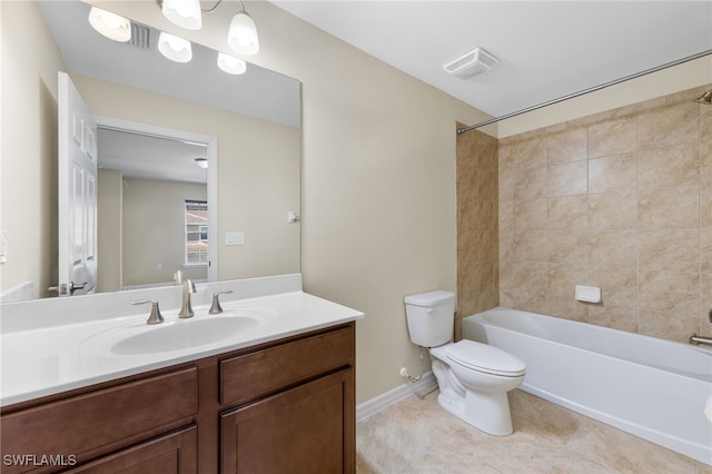 full bathroom featuring vanity, tiled shower / bath combo, toilet, and tile patterned flooring