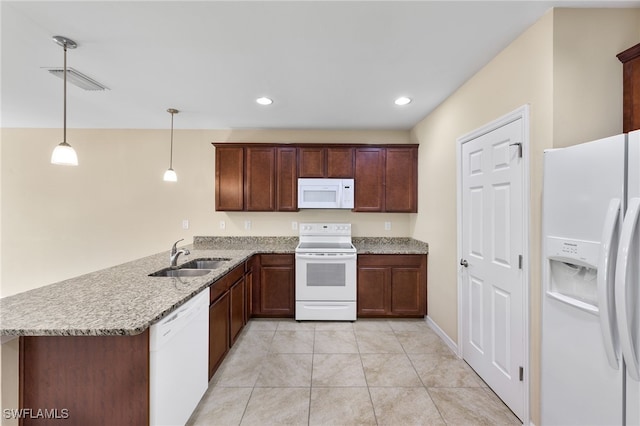 kitchen with kitchen peninsula, white appliances, hanging light fixtures, and sink