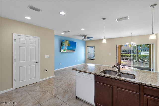 kitchen with light stone countertops, ceiling fan with notable chandelier, sink, dishwasher, and hanging light fixtures