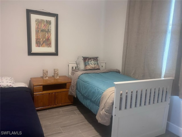 bedroom with light wood-type flooring