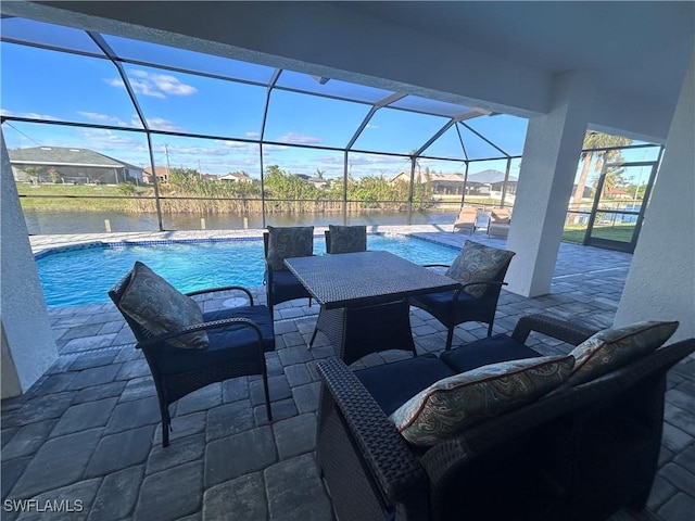 view of patio / terrace with an outdoor living space and glass enclosure